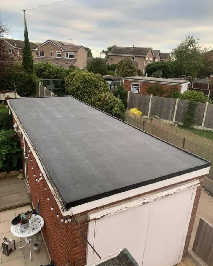 The same garage roof re-covered in a single sheet of EPDM rubber with new edge trims